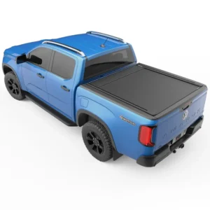 Blue Volkswagen Amarok with black tonneau cover viewed from rear side angle.