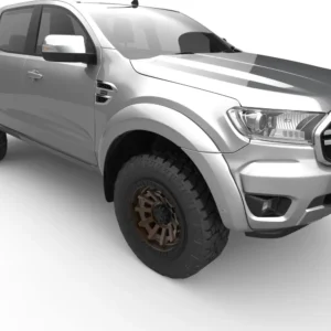 Silver pickup truck with off-road tires and bronze alloy rims on a white background