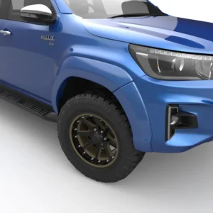 Close-up view of a blue Toyota Hilux 2020 front wheel with EGR fender flares.