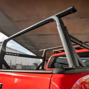 Ford Ranger with EGR RollTrac Roller Cover and Ladder Rack EGR adjustable ladder rack installed on a red Ford Ranger with RollTrac cover.