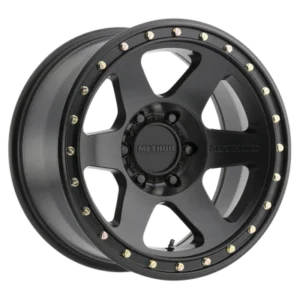 Method Race Wheels 310 Con 6 matte black wheel with six-spoke design and beadlock-style bolts.