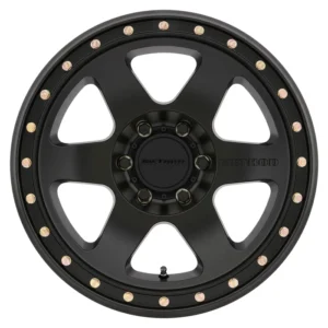 Method Race Wheels 310 Con 6 matte black 6-lug wheel with beadlock-style rim bolts.