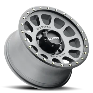 Angled studio view of Method Race Wheels 305 NV Titanium alloy wheel with beadlock styling