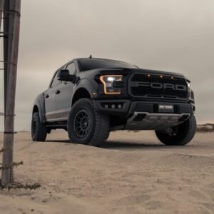 Ford F-150 Raptor fitted with Method Race Wheels off-road wheels driving on sandy terrain
