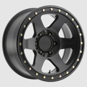 Method Race Wheels 310 Con 6 matte black alloy wheel with simulated beadlock lip and gold bolts