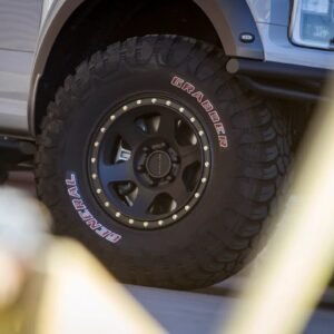 Method Race Wheels 310 Con 6 matte black wheel fitted to 4x4 with off-road tyre in urban driveway setting