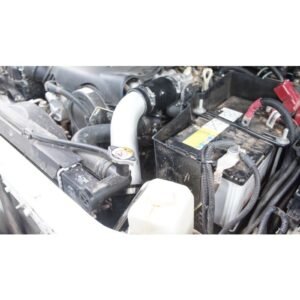 Complete Intercooler Kit with Piping and Installation Hardware Engine bay with aftermarket intercooler piping installed beside vehicle battery