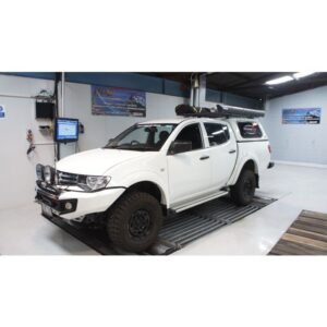 Complete Intercooler Kit with Piping and Installation Hardware White Mitsubishi Triton with aftermarket intercooler upgrade on dyno test