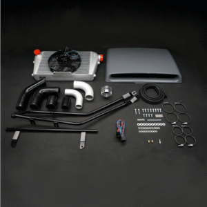 Complete top-mount intercooler kit with radiator, piping, hoses, brackets, clamps, wiring, and hardware laid out on a black background.