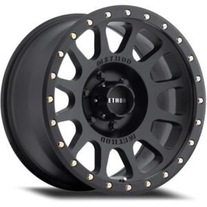 Angled view of Method Race Wheels 305 NV Matte Black alloy wheel with simulated beadlock design.