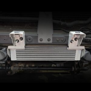 Nissan Navara NP300 transmission cooler kit installed with heavy-duty mounting brackets