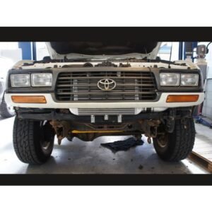 HPD Series 2 Toyota Landcruiser 80 Series Front Mount Intercooler Kit Toyota Landcruiser 80 Series front mount intercooler installed behind grille.