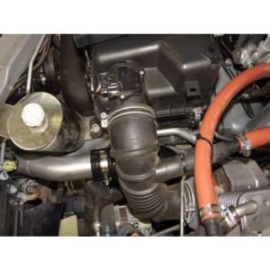 Engine bay with catch can installation and intercooler piping setup.