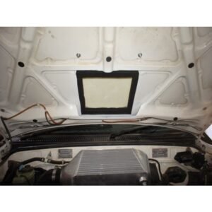 Vehicle engine bay with hood insulation and top-mounted intercooler