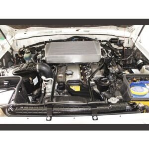 Toyota Landcruiser 80 Series engine bay with top mount intercooler installed