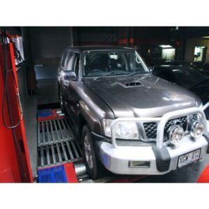 Nissan Patrol SUV on a dynamometer during performance testing.