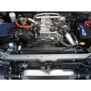 Engine bay with front-mount intercooler and upgraded piping system.