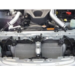 Front mount intercooler connected to turbo piping inside engine bay