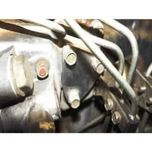 Close-up of engine fuel injection lines and mounting bolts on a diesel engine