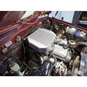 HPD top mount intercooler fitted to Toyota Landcruiser 80 Series 1HD-FT engine bay.