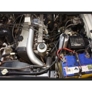 Toyota Landcruiser 105 Series 1HZ engine bay with HPD Series 2 intercooler piping and catch can installed