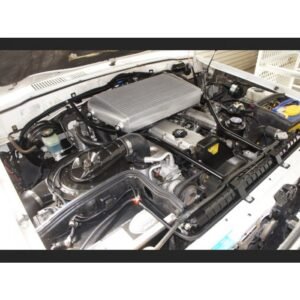 Toyota Landcruiser 80 Series top mount intercooler installed in engine bay – angled view