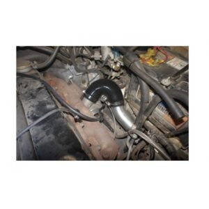 Aluminium intercooler piping with black silicone elbow installed in engine bay