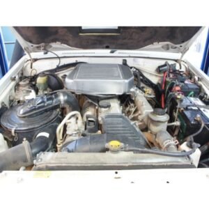 Toyota LandCruiser 70 Series 1HZ engine bay fitted with HPD top mount intercooler kit