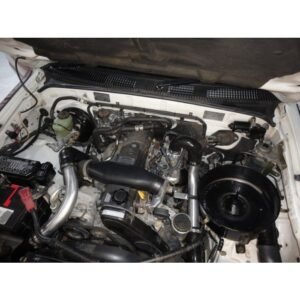 Toyota Hilux 3.0L 1KZ-TE engine bay with full HPD front-mount intercooler kit installed
