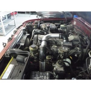 Toyota Landcruiser 80 Series 1HZ engine bay fitted with HPD front mount intercooler piping and hoses.