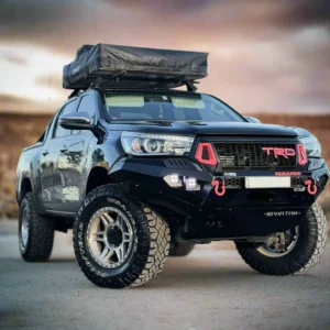 Toyota Hilux Revo N80 fitted with Spartan Bull Bar, off-road tires, and roof tent setup
