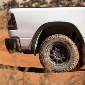 Alt Text: Method Race Wheels 316 Matte Black installed on off-road truck driving through desert terrain