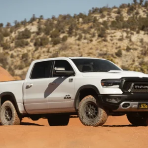 White RAM truck fitted with Method Race Wheels 316 Matte Black driving off-road in desert terrain