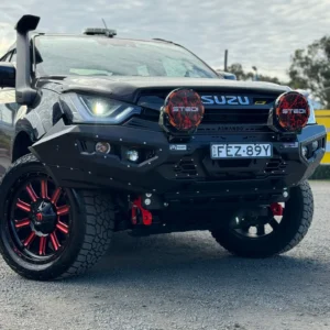 Angled front view of Isuzu D-Max 2021–2023 with Spartan Bull Bar, STEDI lights, and red recovery hooks
