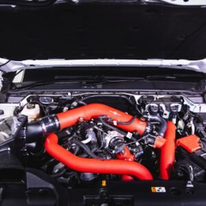 Next Gen Ranger Raptor engine bay with Process West wrinkle red 3.5-inch crossover pipe kit installed