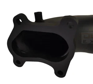 Close-up of turbo flange on black high-flow dump pipe